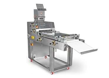 Wie funktioniert eine Teigdehnmaschine in einer Bäckerei?